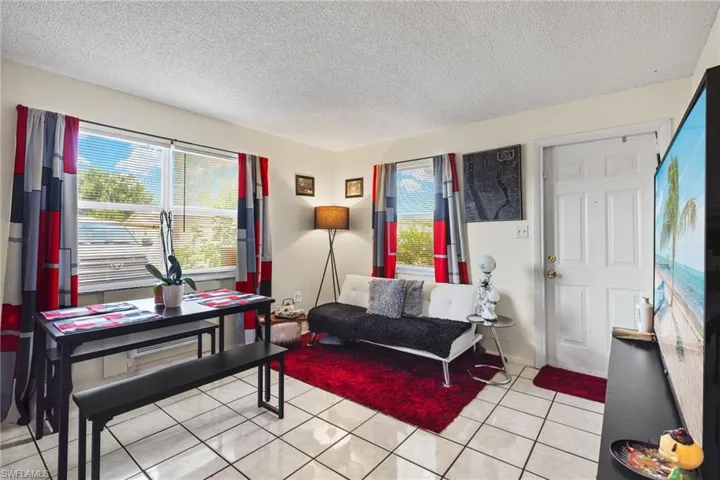 Newer windows provide plenty of natural light. Easy to care for tile throughout apartments.