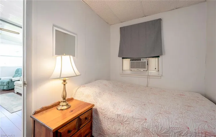 Bedroom featuring cooling unit and hardwood / wood-style floors