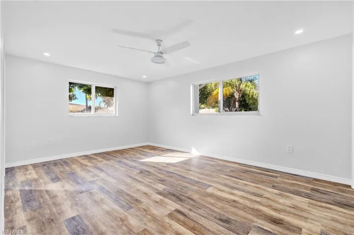Unfurnished room with recessed lighting, light wood-type flooring, and a ceiling fan