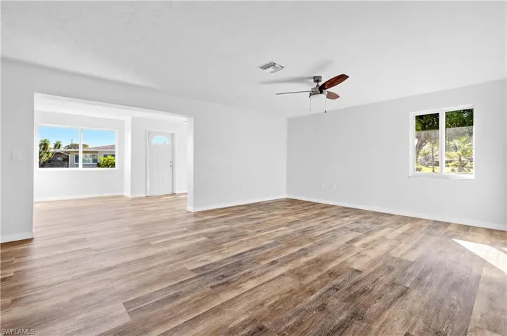 Spare room with light wood-style flooring and a ceiling fan