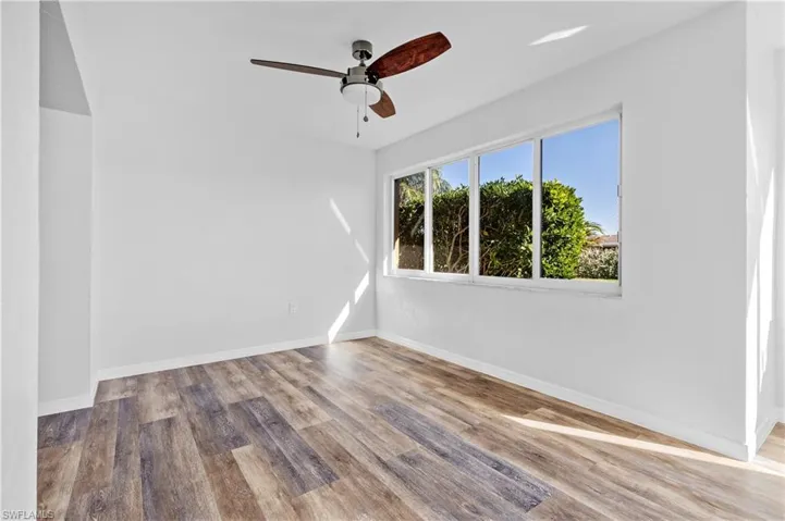 Unfurnished room featuring light wood-style floors and a ceiling fan
