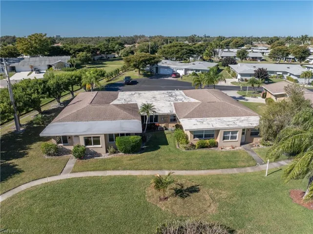 Aerial perspective of suburban area featuring a tree filled landscape