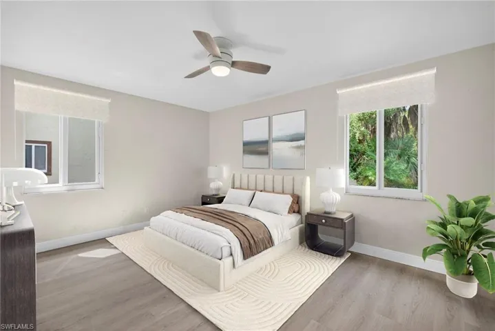 Bedroom featuring wood finished floors and ceiling fan