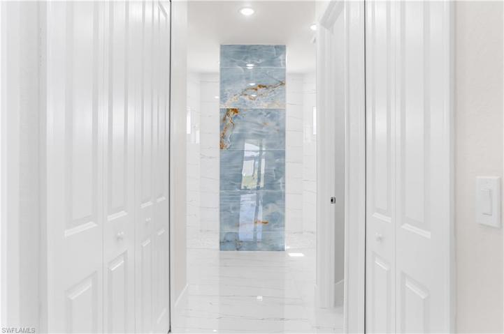 Hall from master bedroom with large walk-in closets