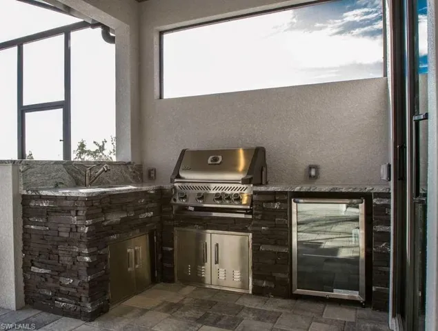 This photo is close to what the outdoor kitchen looks like but not exact.