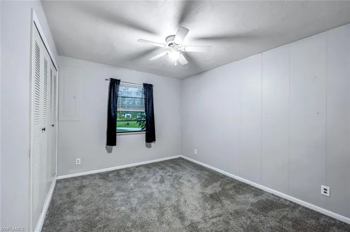 bedroom room featuring grey carpet and ceiling fan