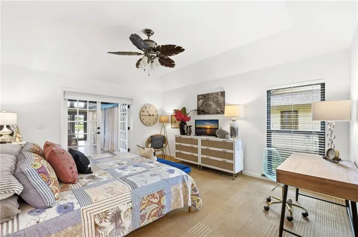 Primary bedroom with spacious layout and direct access to sunroom/Florida room