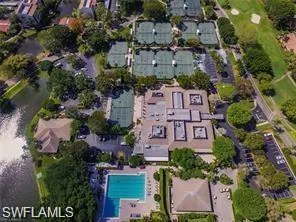 Aerial view of property and surrounding area with a pool