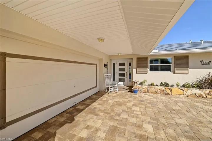 View of patio with a garage