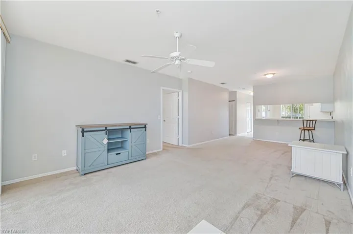 Living room featuring light carpet