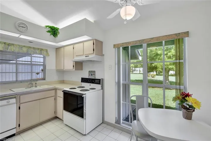 Kitchen and breakfast area overlooking backyard