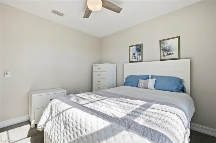 Bedroom featuring carpet floors and a ceiling fan