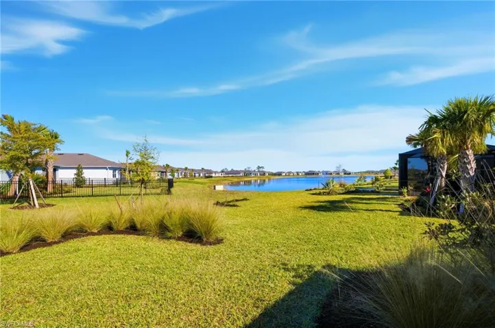 View of yard with a water view and a residential view