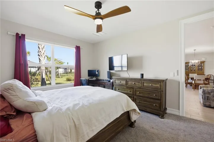 Bedroom with carpet flooring and a ceiling fan