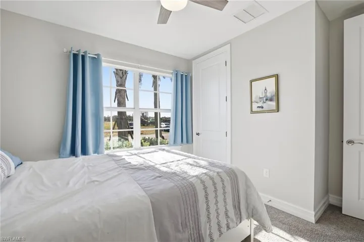 Bedroom with carpet flooring and ceiling fan
