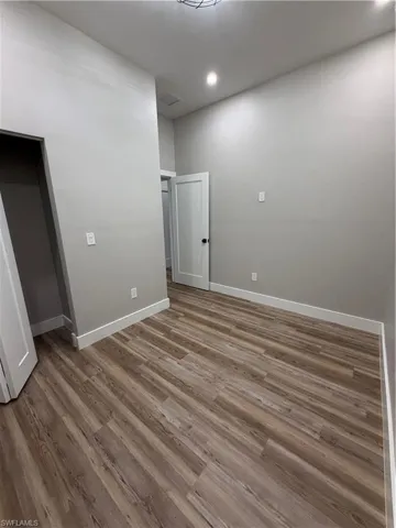 Spare room featuring light wood-type flooring and recessed lighting