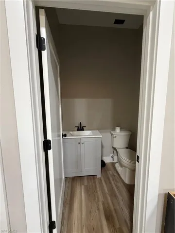 Bathroom with vanity and light wood-type flooring
