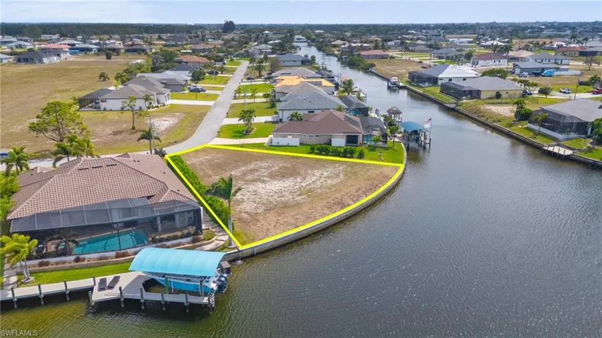 Aerial view with a water view and a residential view