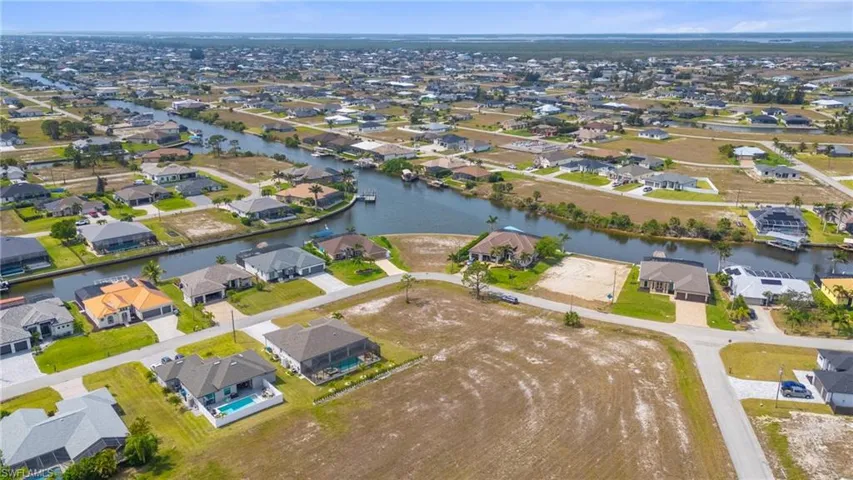 Birds eye view of property featuring a residential view and a water view