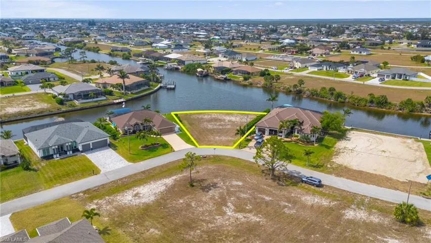 Birds eye view of property featuring a residential view and a water view