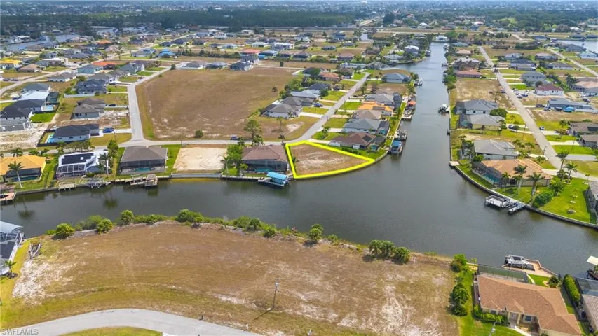 Drone / aerial view with a residential view and a water view