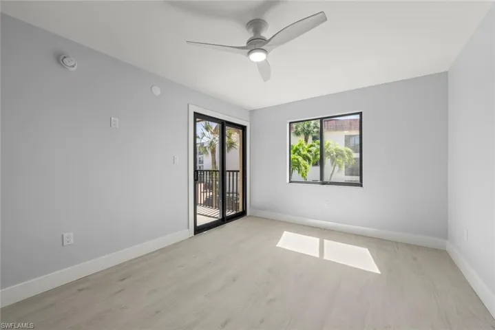 Spare room with light wood-style flooring and ceiling fan