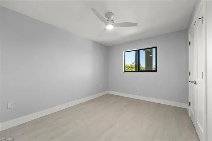 Spare room featuring light wood-type flooring and a ceiling fan