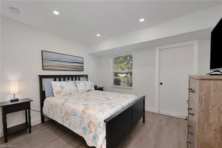 Bedroom featuring light wood-type flooring and baseboards