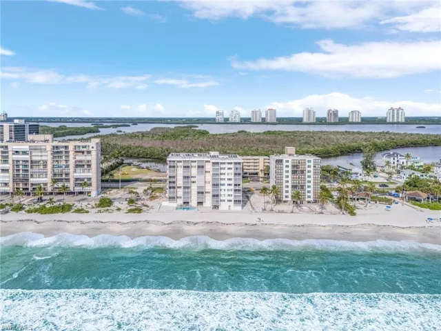 Bird's eye view shows The Egret from the beach side. Building in process of painting to be complete in October 2024.