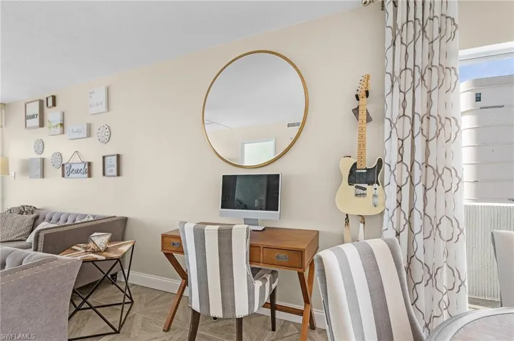 Extra space in this residence allows for a desk. (Guitar and computer not included in purchase.)