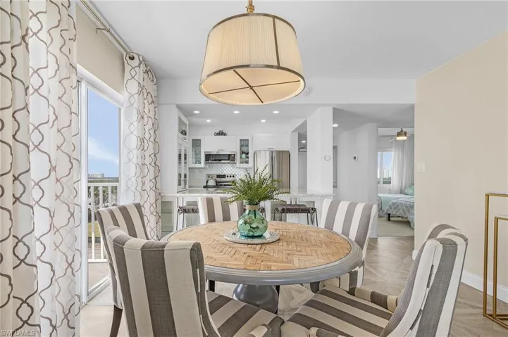 Dining area features natural light and beach views to the north and west.