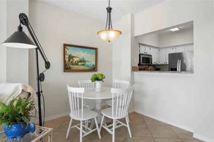 Dining space featuring light tile patterned flooring