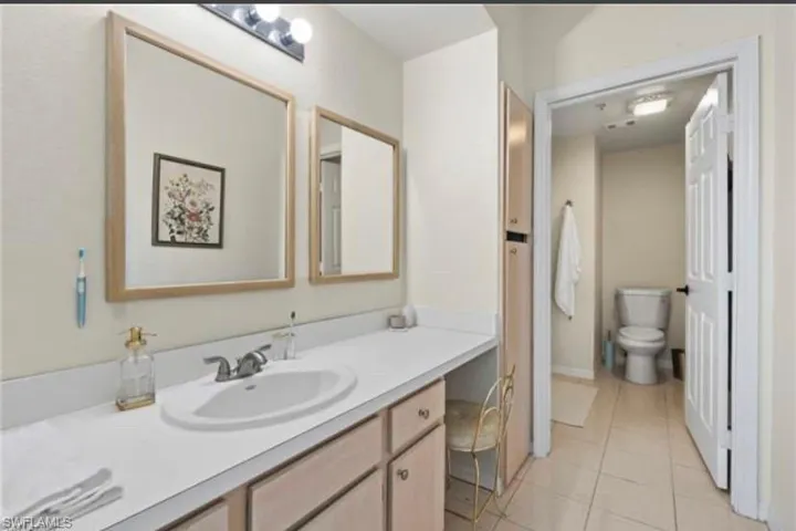 Bathroom featuring vanity and light tile patterned floors