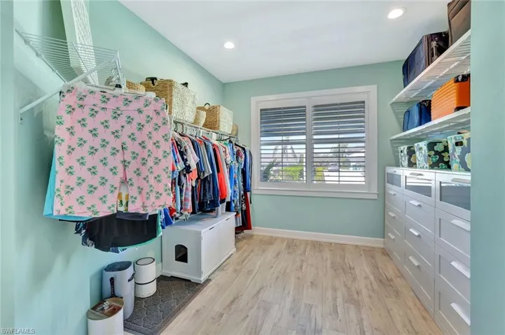 Spacious closet featuring wood finished floors