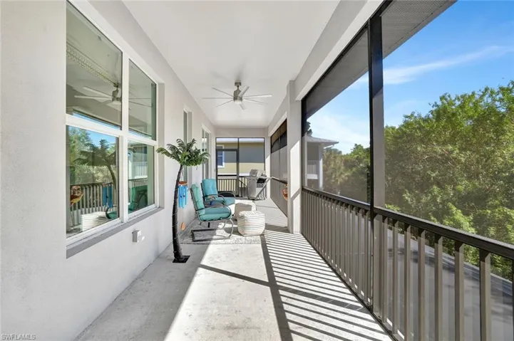 Sunroom featuring ceiling fan