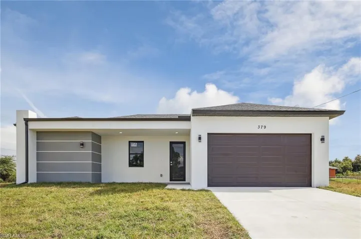 View of front of house with a garage, a front lawn, driveway, and stucco siding (Similar Model)