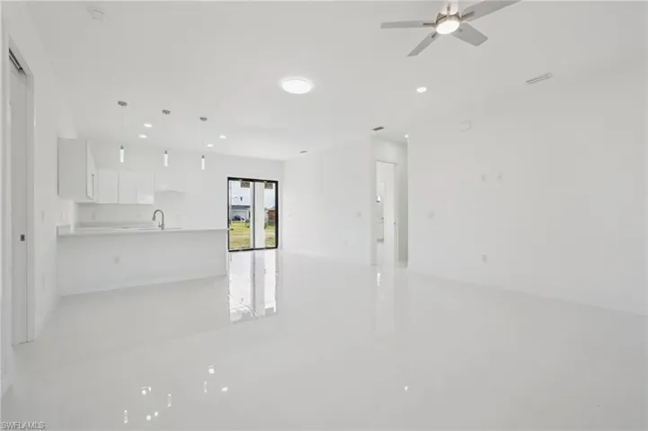 Unfurnished living room with recessed lighting and a ceiling fan