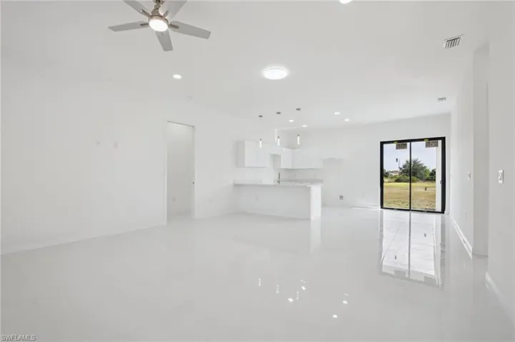 Unfurnished living room with recessed lighting and ceiling fan
