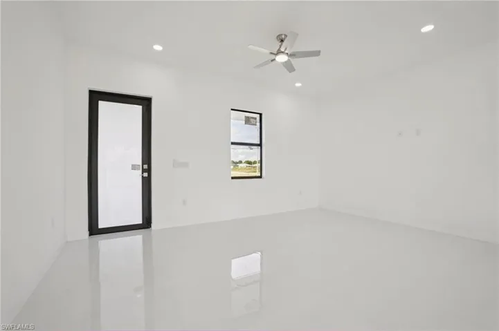 Unfurnished room featuring ceiling fan and recessed lighting