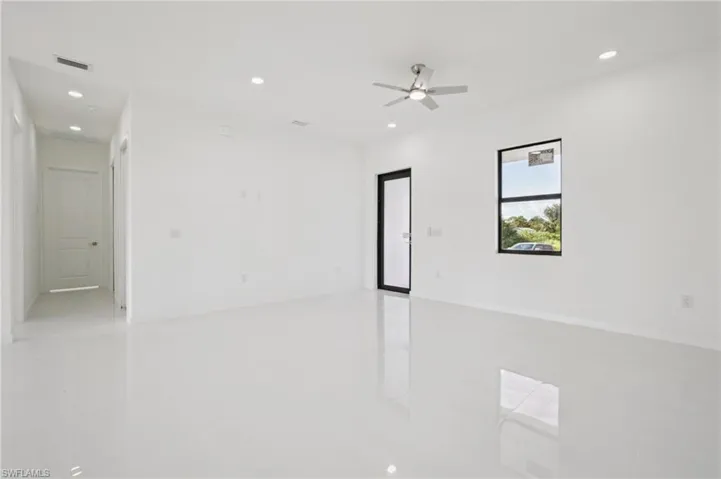 Empty room with recessed lighting and ceiling fan