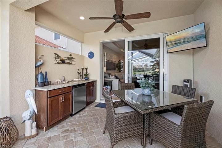 Gracious covered area, cabinets w/beverage fridge