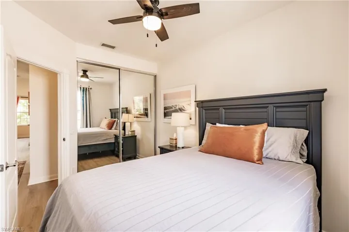 Bedroom featuring a closet, hardwood / wood-style floors, and ceiling fan
