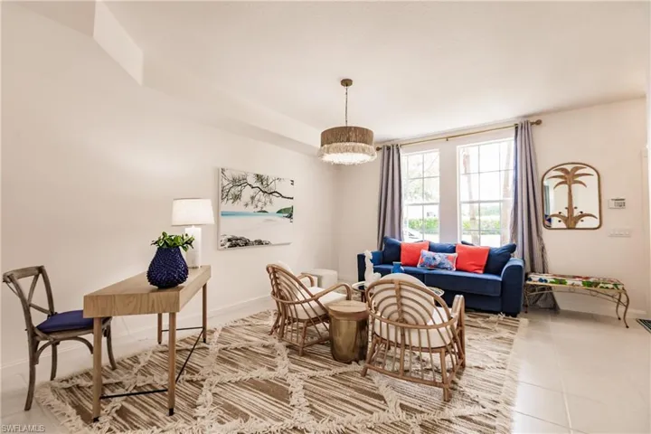 Sitting room featuring a notable chandelier and light tile patterned floors