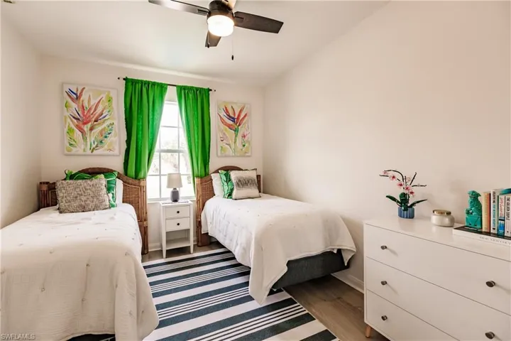 Bedroom featuring hardwood / wood-style flooring and ceiling fan