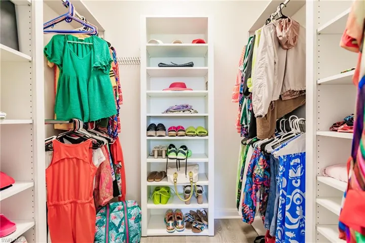Walk in closet featuring hardwood / wood-style flooring