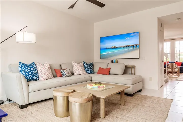 Tiled living room with ceiling fan