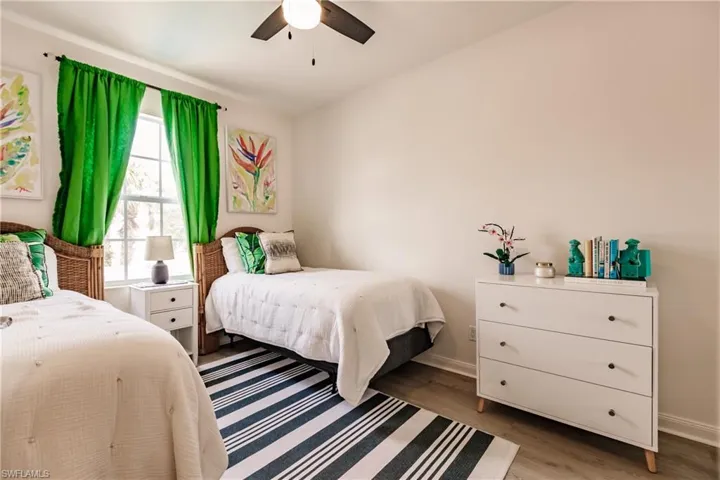 Bedroom featuring light hardwood / wood-style flooring and ceiling fan