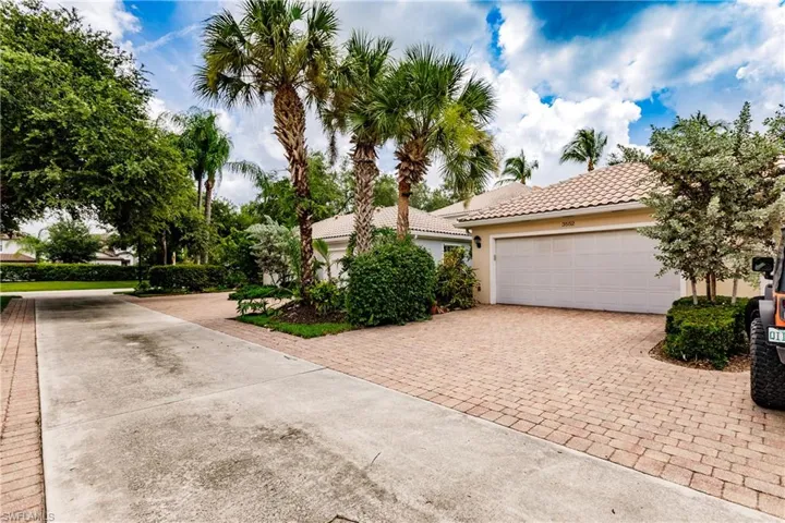 View of back of property featuring a garage
