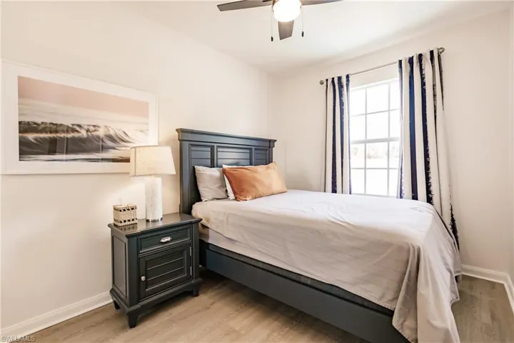 Bedroom featuring light hardwood / wood-style flooring and ceiling fan