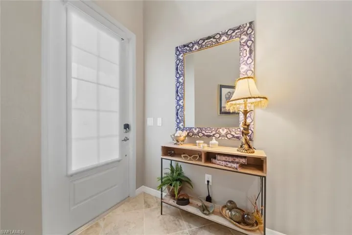 Doorway to outside with light tile patterned flooring